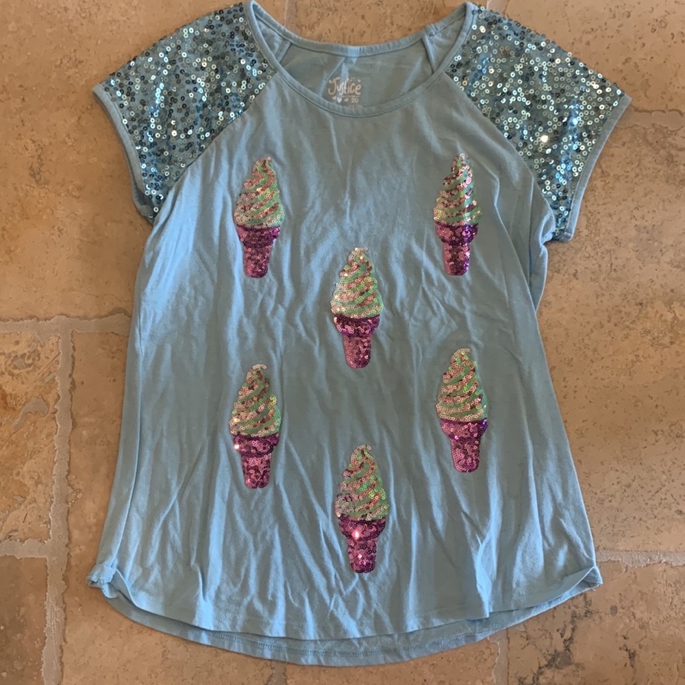 A cute top in the brand justice